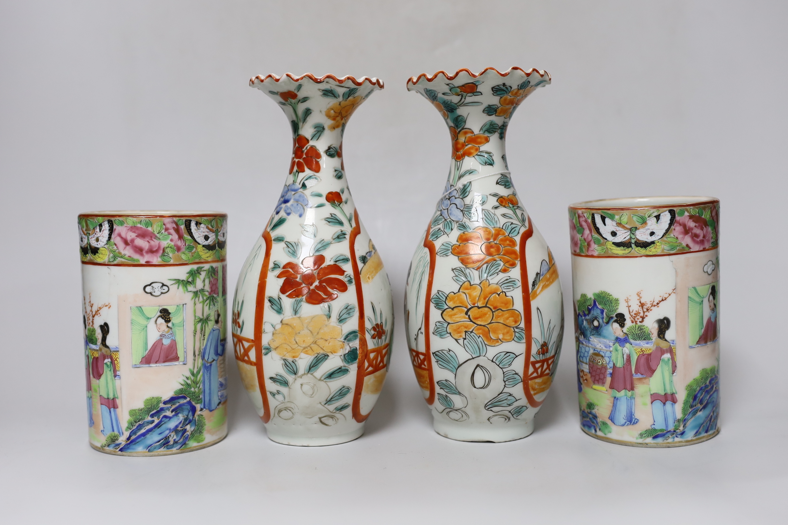 A pair of 19th century Cantonese famille rose porcelain brushpots, decorated with figural scenes, together with a further pair of Japanese export vases (4)